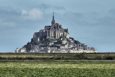 View of temple against cloudy sky