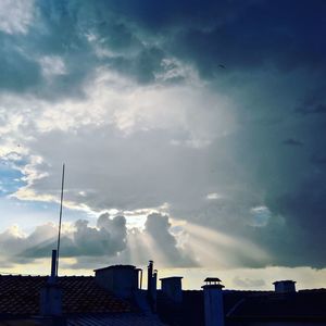 Low angle view of building against cloudy sky