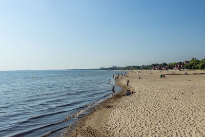 Scenic view of beach against clear sky