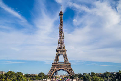 Low angle view of tower against cloudy sky