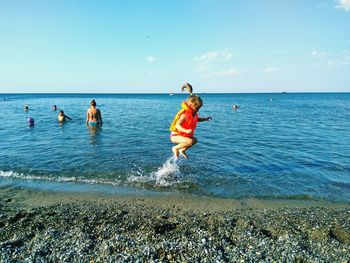 People enjoying at beach