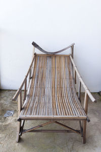 Empty wooden chair in front of sea