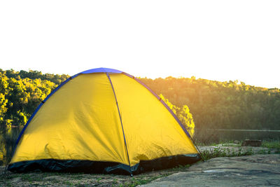 Yellow tent against clear sky