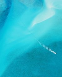 High angle view of airplane flying over swimming pool