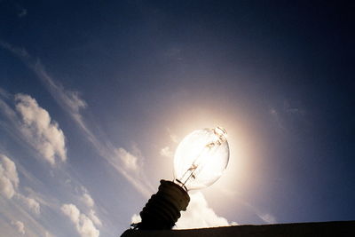 Low angle view of silhouette person against sky