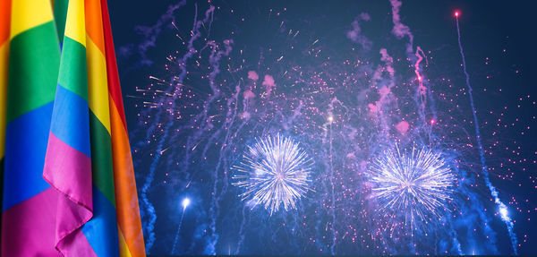 Low angle view of firework display at night