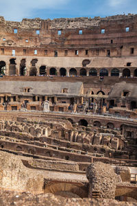 View of the seating areas and the hypogeum of the ancient colosseum in rome