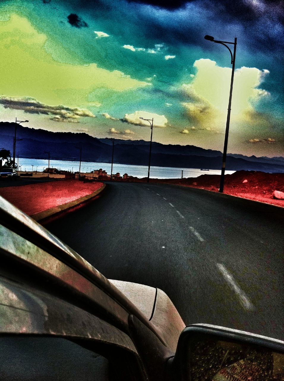 transportation, sky, cloud - sky, mode of transport, road, car, land vehicle, water, road marking, street, cloudy, cloud, vehicle interior, the way forward, outdoors, asphalt, part of, travel, weather, nature