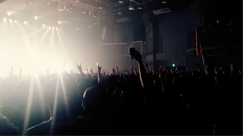 Rear view of people enjoying music concert