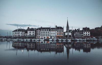 Buildings in calm sea