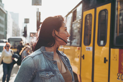 Full length of woman looking at city