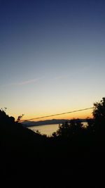 Scenic view of sea against clear sky during sunset