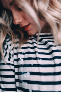 Close-up of young woman looking down