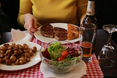 Close-up of man preparing food on table