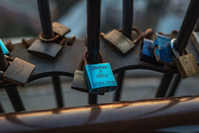 Close-up of padlocks on railing