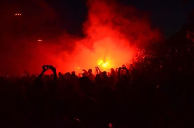 Silhouette crowd gathered at bonfire festival