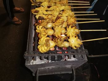 High angle view of meat on barbecue grill