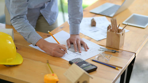 High angle view of man working on table