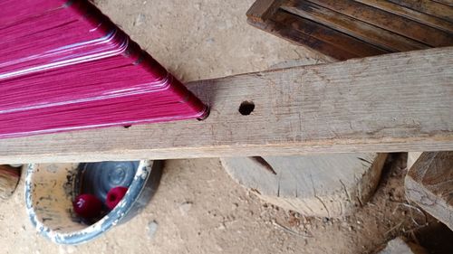 High angle view of metallic container on wood