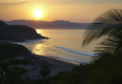 Scenic view of beach during sunset