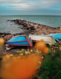 Boat in sea against sky