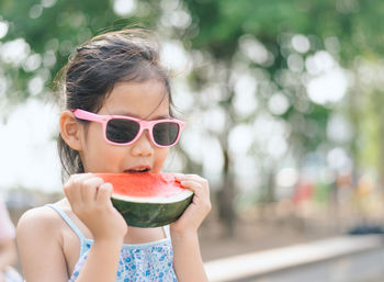 Cute girl eating watermelon