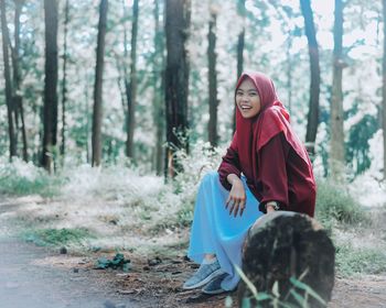 Woman sitting in a forest