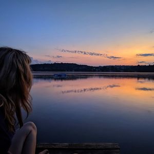 Rear view of woman looking at sunset