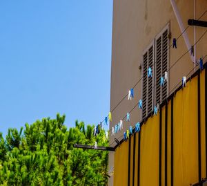 Low angle view of building against clear blue sky