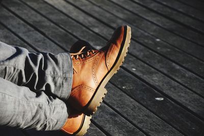 Low section of man on boardwalk