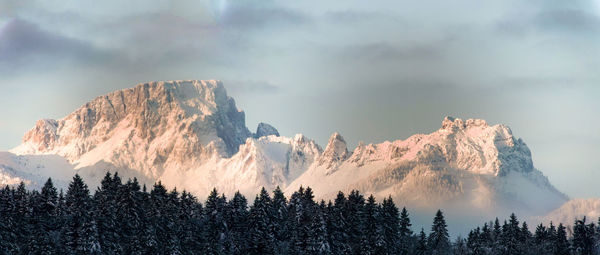 Panoramic view of mountains against sky during winter