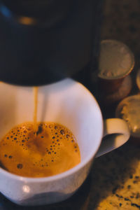 High angle view of coffee cup on table