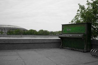 Empty road with buildings in background