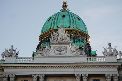Low angle view of hofburg against sky in city