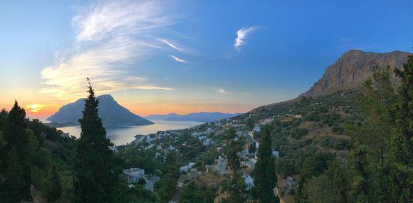 Panoramic view of mountains against cloudy sky