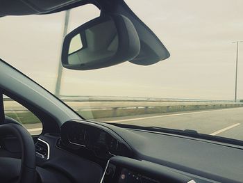 Cropped image of car on road