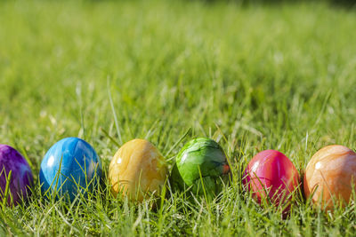 Close-up of easter eggs on grassy field