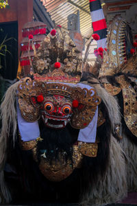 Close-up of mask for sale in market