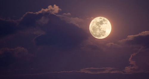 Low angle view of moon against sky at night