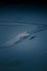 High angle view of sea waves against sky