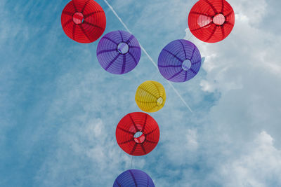 Low angle view of lanterns against sky