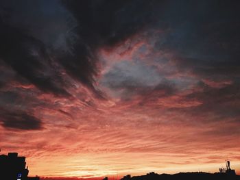 Low angle view of dramatic sky during sunset