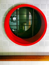 Close-up view of red mirror