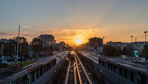 High angle view of traffic on city during sunset