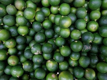 Full frame shot of limes in market for sale