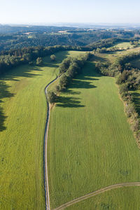 High angle view of grassy field against sky