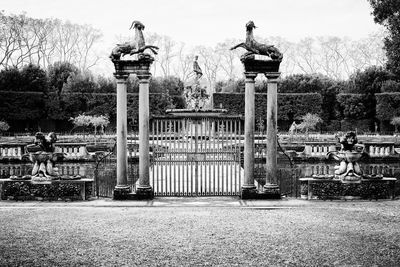 Statue in park against sky