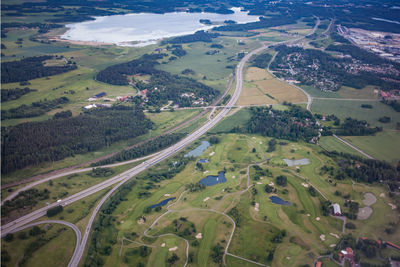 Aerial view of lake by field