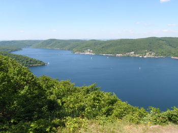 High angle view of trees and sea against sky