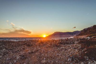 Scenic view of sea against sky during sunset